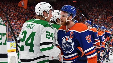Connor McDavid shakes hands with Roope Hintz