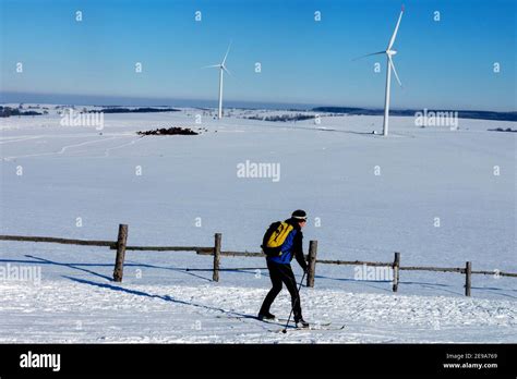 Cross-country skier in a snowy landscape