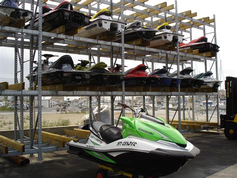 Jet ski being covered for storage
