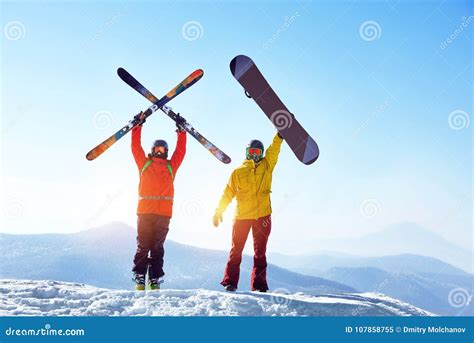 Snowboarder and Skier