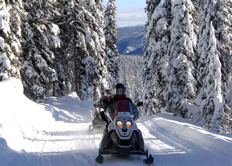 Snowmobile on a groomed trail