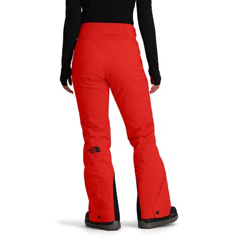 Woman in red snowboard pants